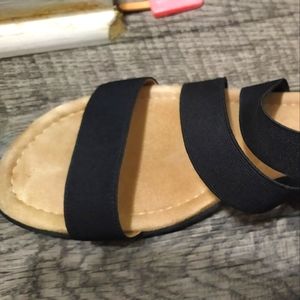 Black stripes flat sandal almost new. With soft system support